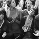 To pass the long morning, young women clap and sing along to a freedom song between speeches at the March on Washington for Jobs and Freedom, Washington DC, August 28, 1963.